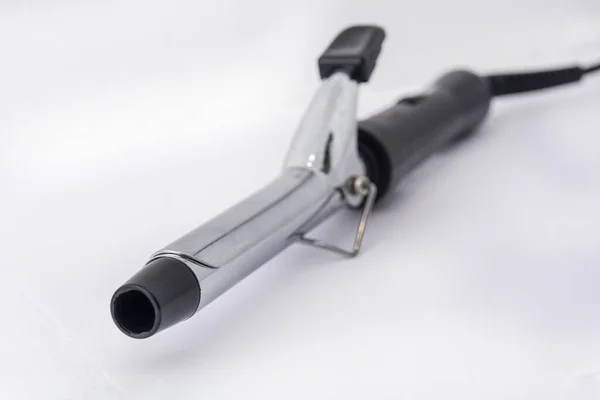 Electric hair curlers. iron curling irons with an ergonomic handle, on a white background.