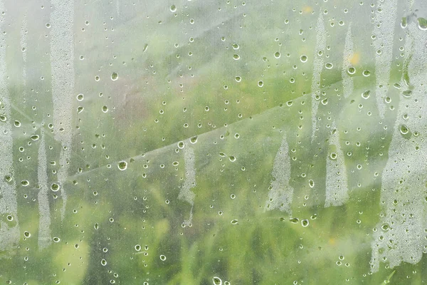 macro texture water drops. Many small drops of water on plastic film.