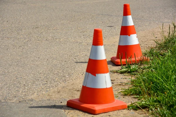 Transport cone, with white and orange. Concept: Direction of transport or flow of people, road safety. Royalty Free Stock Photos
