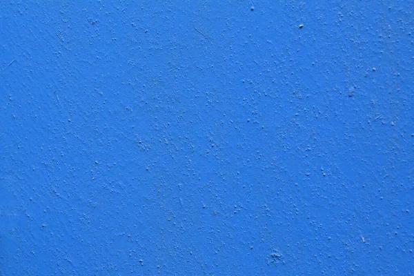 Parede de concreto é pintado com tinta azul. Fundo abstrato. Textura para projeto e projeto . — Fotografia de Stock