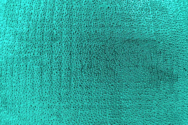 Green abstract background. Abstract drops on a green textured ba