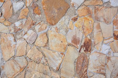 Büyük düz taşların dokusu. Soyut doğal arkaplan. Duvarcılık kavramı doğal, işlenmemiş taşlardan yapılmıştır..