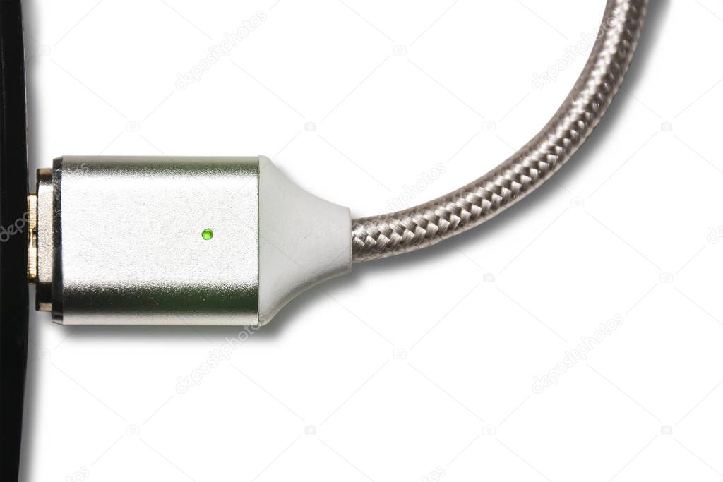USB cable, the cable is connected to the device. to close up. Concept of charging devices, dependence, energy and safety.