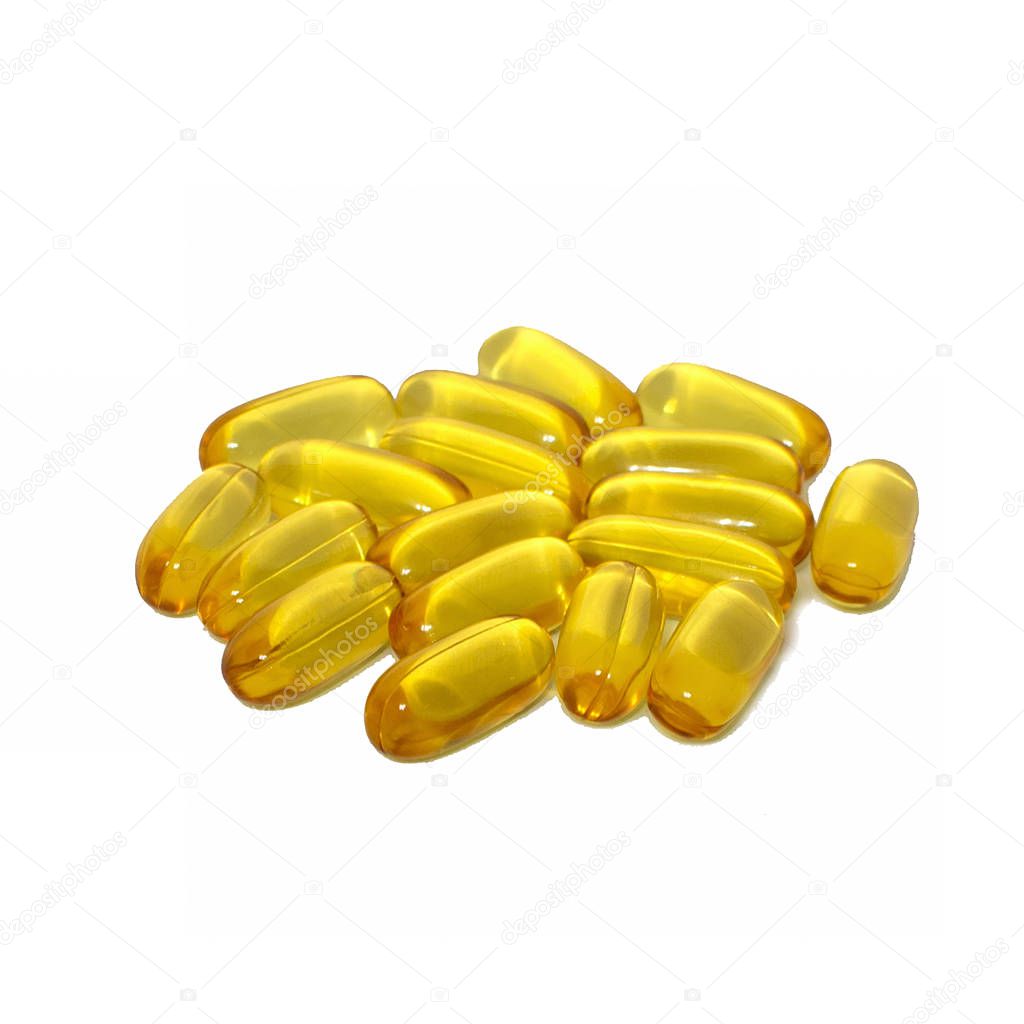 Yellow fish oil capsules isolated on white background. Omega 3 concept: health