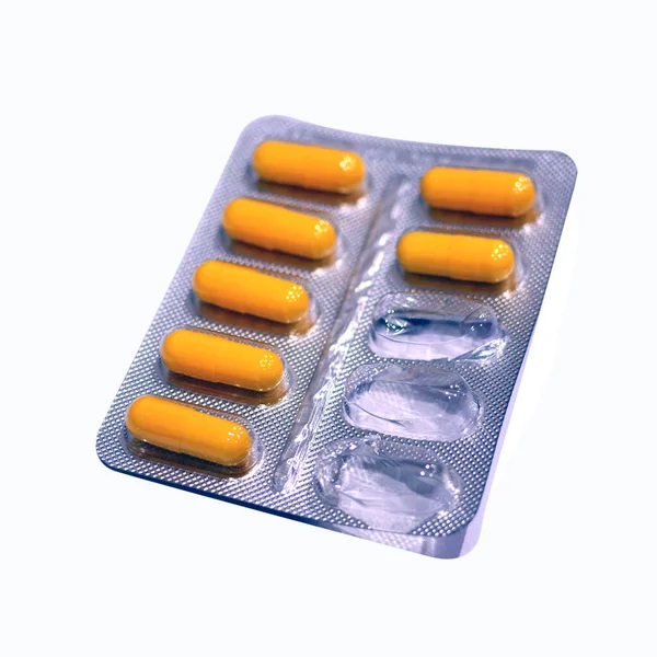 Pills closeup isolated on white background. three pills are missing. — Stock Photo, Image
