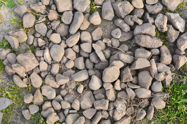 Fundo de pedras castanhas. Pedras naturais para fundo. Muitas pedras no chão. Contexto abstrato . — Fotografia de Stock