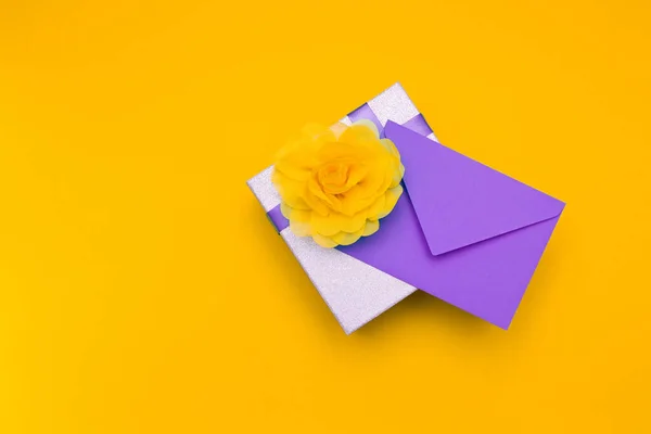 Purple Envelope Lies Silvery Shiny Box Purple Ribbon Large Yellow — Stock Photo, Image