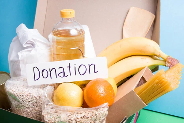 Inscripción Donación Cartón Blanco Caja Alimentos Sobre Fondo Azul Verde — Foto de Stock
