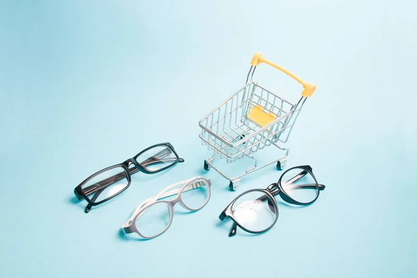 Small Shopping Trolley Focus Children Glasses Two Pairs Black Glasses — Stock Photo, Image