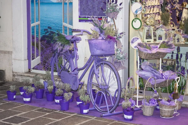 Lavender-colored bicycle and lavender flowers