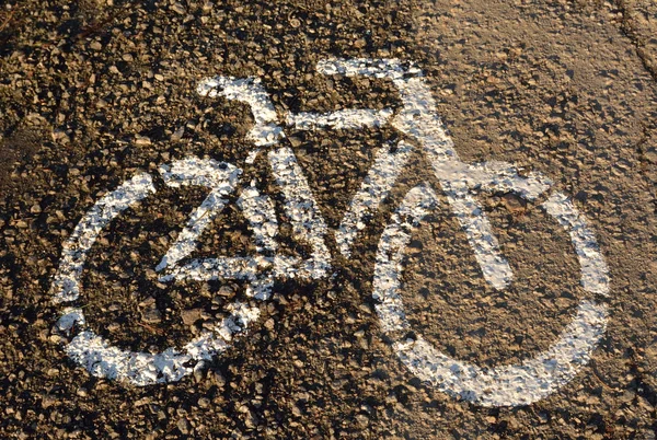 Sign of a bicycle on asphalt — Stock Photo, Image
