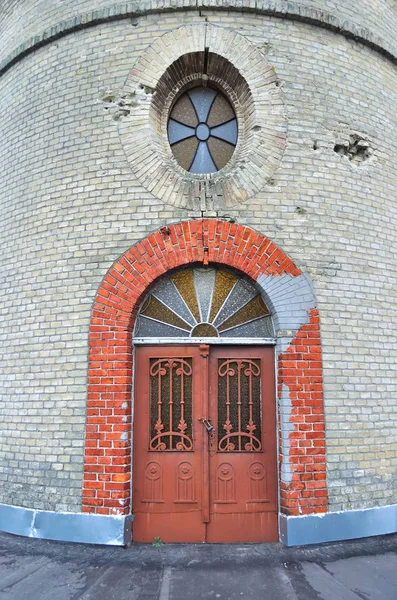 Arc shaped doors bricks surrounded — Stock Photo, Image