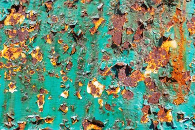 Arkaplan için doku olarak kullanılan yeşil boyayla kaplı metal bir yüzey parçası..