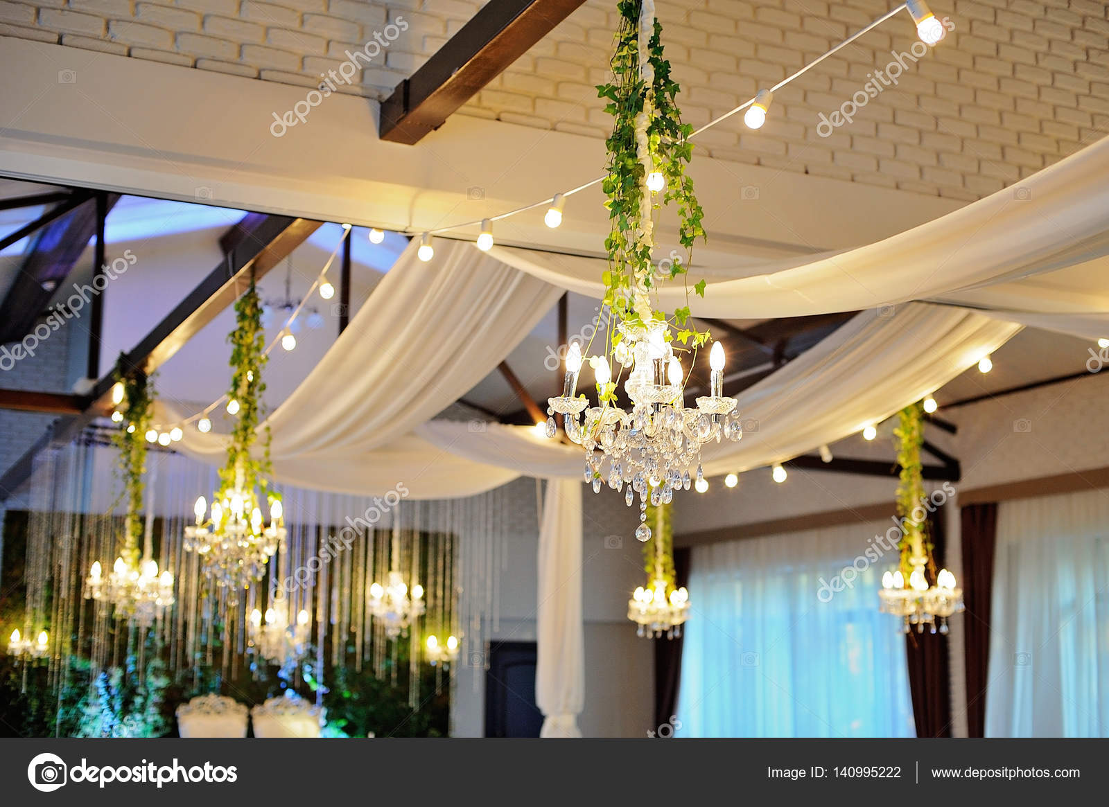 Ceiling Decor With Tulle And Eclectic Chandeliers Stock Photo