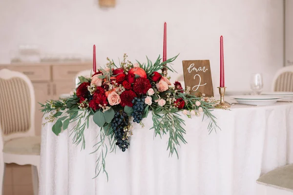 Glorious autumn bouquet on guest wedding table