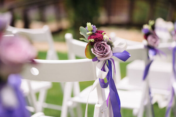 Close up of flower decorated on wedding chair