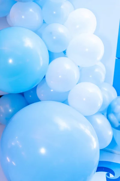 Colorful balloons background, punchy pastel colored and soft focus. Blue and white balloons photo wall birthday decoration