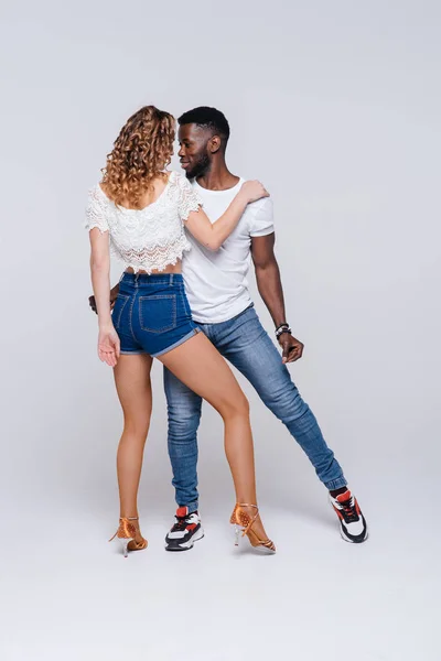 stock image Couple dancers posing over white background. Man and woman are dancing, dance costumes. International dance group. Dancers dance. Passionate original variety of pair of dancers. Fitness concept