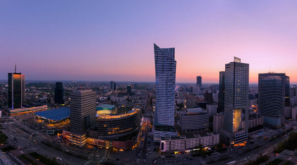 Panorama of Warsaw city with modern skyscraper after sunset, Poland, Europe.