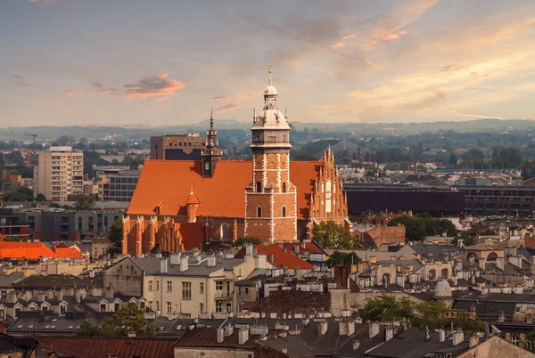 Roofs and the church in sunset light. Krakow — Stock Photo, Image