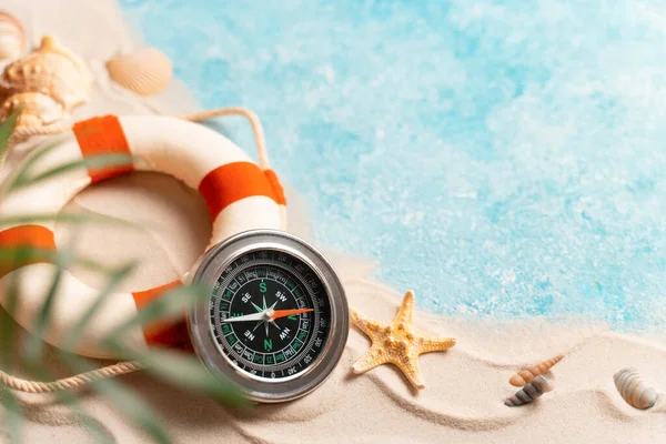 Creative layout of sand waves and sea, summer beach background with shell, sea star, compass life preserver and blurred Palm, vacation and travel concept, Flat lay top view copy space, exotic concept. — ストック写真