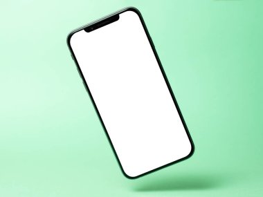 Akıllı telefon modeli, boş ekranlı telefon ve yeşil arka planda izole edilmiş gölge. Hafiflik, tazelik, havalanma sembolü. Boşluğu, modern teknolojileri sosyal ağları ve uygulamaları kopyala.