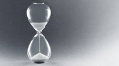 Kopya alanı olan kum saati. Zaman geçirme sembolü, iş bitiş tarihi konsepti, aciliyet ve zaman tükenme.