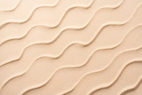 summer beach sand background, vacation and travel concept, Flat lay top view copy space, Minimal exotic concept. Creative layout of sand waves.
