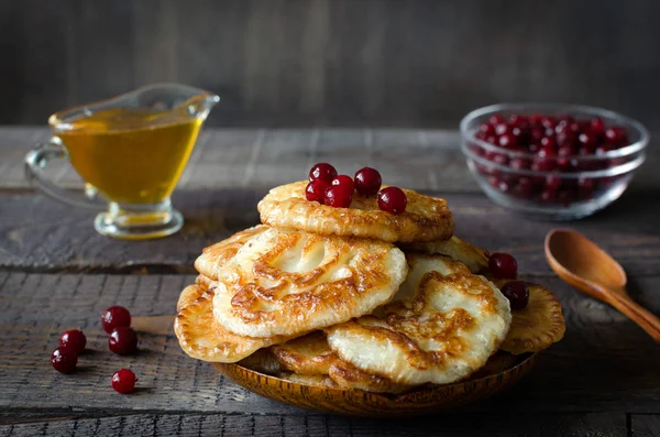 Russian-style fritters on dark wooden background — Stock Photo, Image