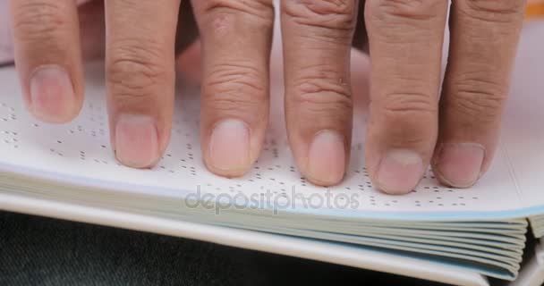 Hands Of Blind Man Reading Braille Language On Book — Stock Video