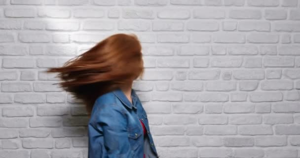 Facial Expressions Of Young Redhead Woman On Brick Wall — Stock Video