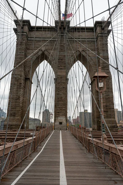 Landscape view of empty Brooklyn Bridge in New York City, empty streets due Covid-19 coronavirus pandemic, USA Stock Image