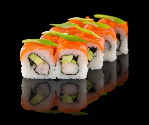 Sushi roll with salmon, shrimp, avocado, tobiko and chive isolated on black background with reflection — Stock Photo, Image