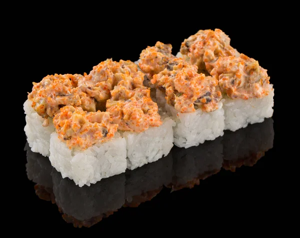 Uramaki Sushi roll isolated on black background with reflection. Sauce with tobiko caviar and mushroom on top of sushi — Stock Image Uramaki Sushi roll isolated on black background with reflection. Sauce with tobiko caviar and mushroom on top of sushi Stock Image