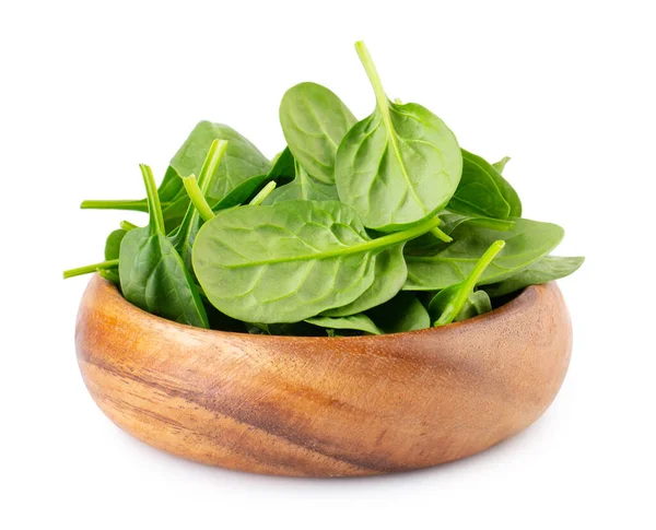 Spinach leafs in wooden bowl isolated on white background — Stock Photo, Image