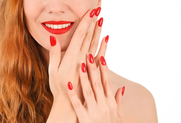 stock image Woman's smile with red lipstick and red nail polish. 