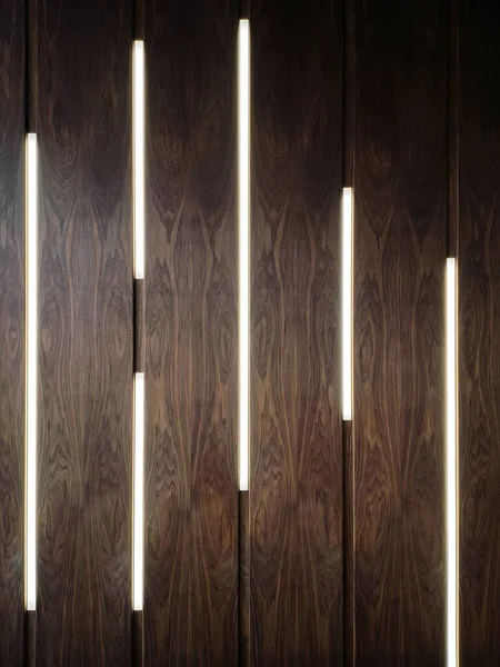exhibition stand or wall panel in oak or walnut veneer with built-in lamps, texture, interior element