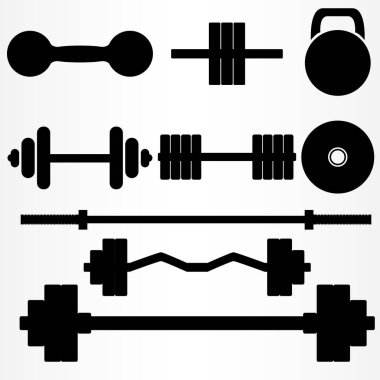 Spor salonunun klasik unsurları. Dokuz farklı halter ve halterden oluşan bir set..