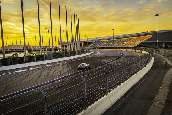 Speed, roar of engines, cars like a whirlwind rush on the track in Sochi,