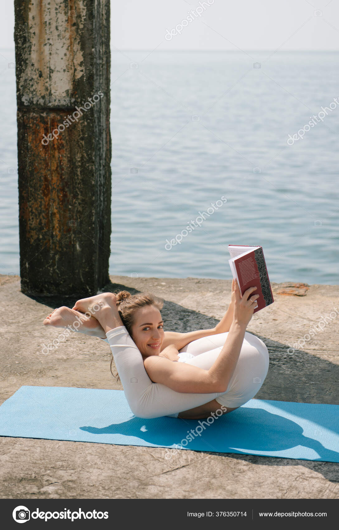 Young Woman Reading Book While Practicing Yoga Seaside Woman Doing Stock Photo Image By C Dragonfly666 376350714