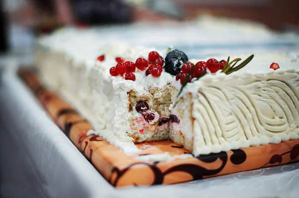 Cut cake on the table. Cake with berries