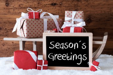 Hediyeler ile kızak üzerinde kar, metin mevsim selamlar