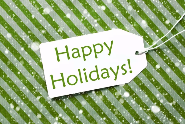 包装紙雪片、本文幸せな休日で緑のラベル — ストック写真