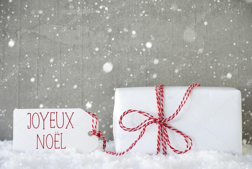 Gift, Cement Background With Snowflakes, Joyeux Noel Means Merry Christmas