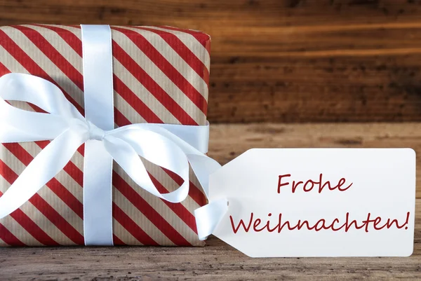 Presente con etiqueta, Frohe Weihnachten significa Feliz Navidad —  Fotos de Stock