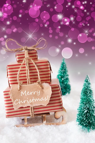 Vertikale Schlitten auf lila Hintergrund, Text meery Weihnachten — Stockfoto