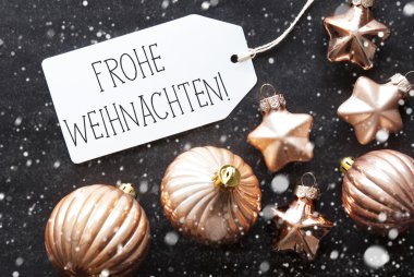 Bronz toplar, kar taneleri, Frohe Weihnachten mutlu Noeller anlamına gelir.
