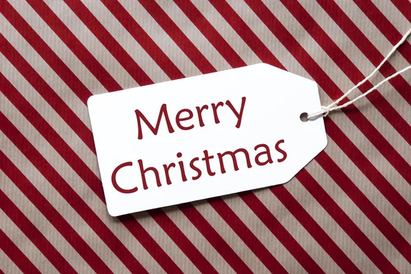 Etiqueta em papel de embrulho vermelho, texto Feliz Natal — Fotografia de Stock