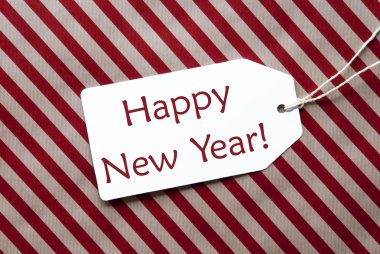 Etiket üzerindeki kırmızı paket kağıdı, metin mutlu yeni yıl