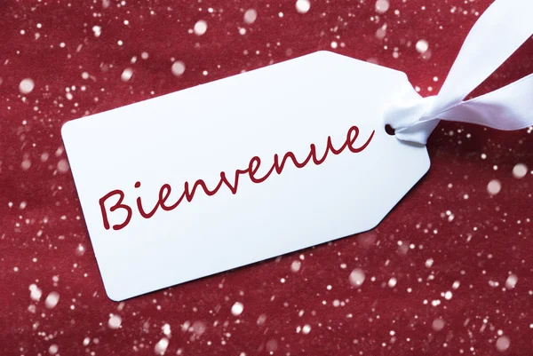 Címkén piros háttér, hópelyhek, Bienvenue azt jelenti, Welcome — Stock Fotó